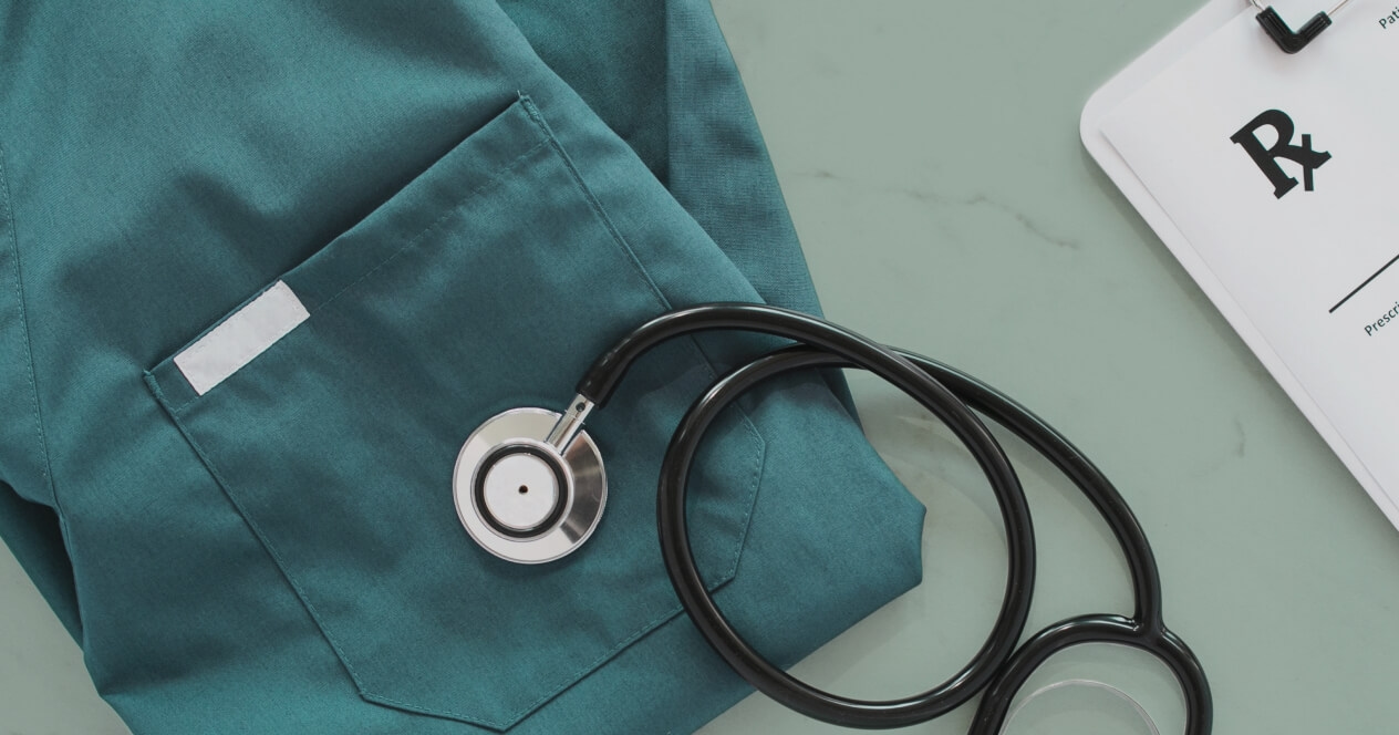 Doctor's scrubs, stethoscope, and clipboard