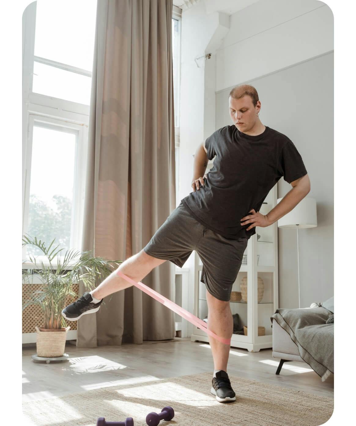 Man doing physical therapy exercise at home